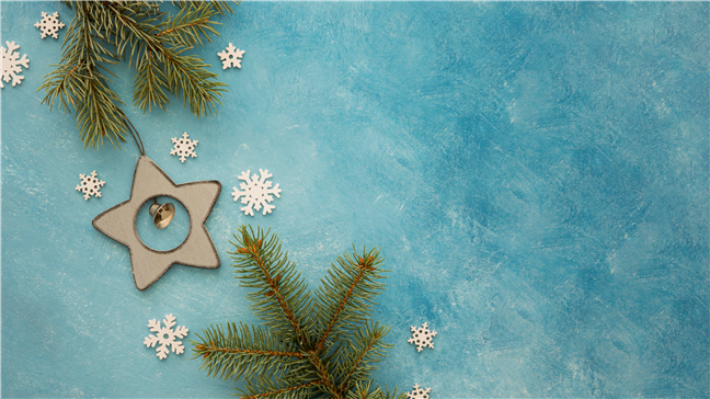 Pine leaves and snowflakes copy space by freepik